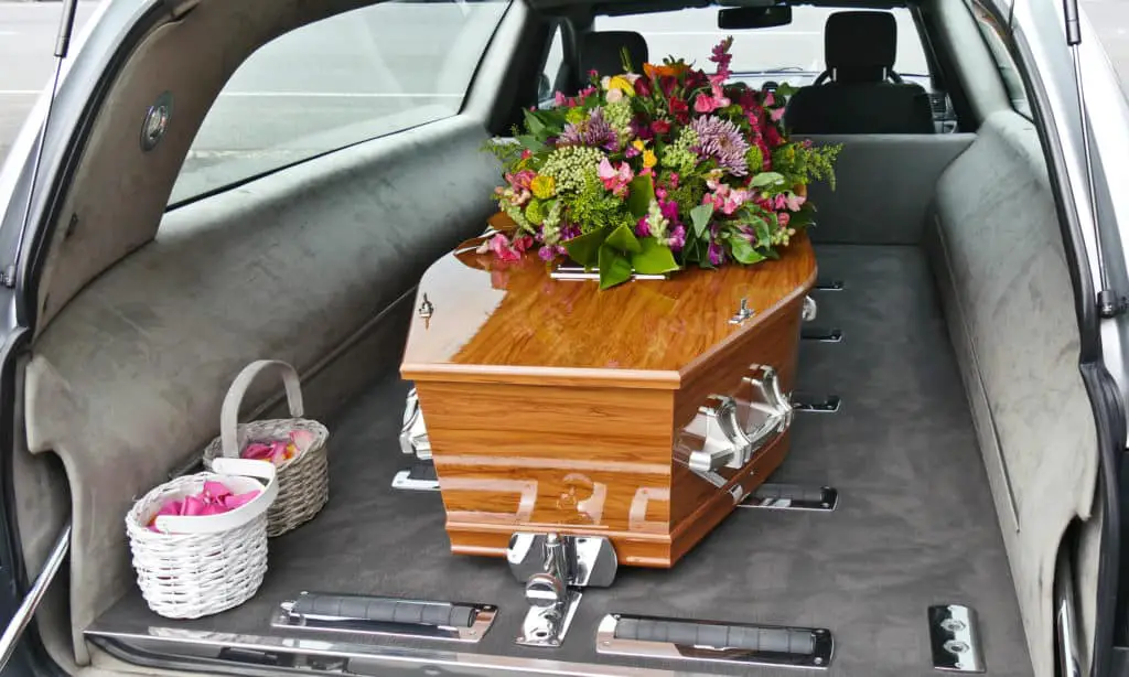 coffin in back of a hearse