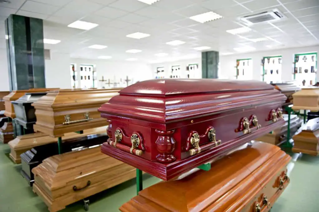 Variuos caskets displayed in a casket store.