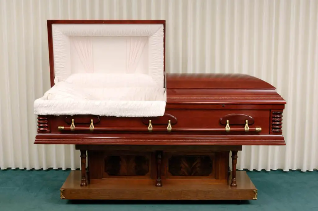 Wooden casket made of Cherry in a funeral home.