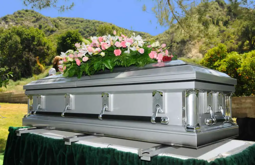 Image of a stainless steel Casket with Flowers