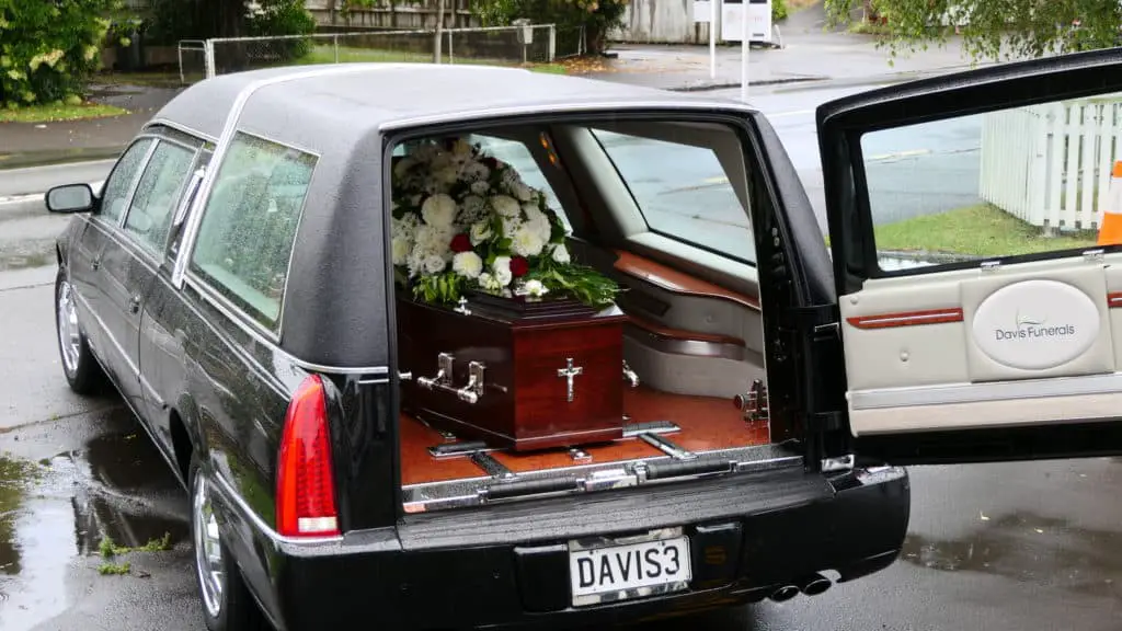 Closeup shot of a funeral casket in a hearse or chapelsor burial at cemetery