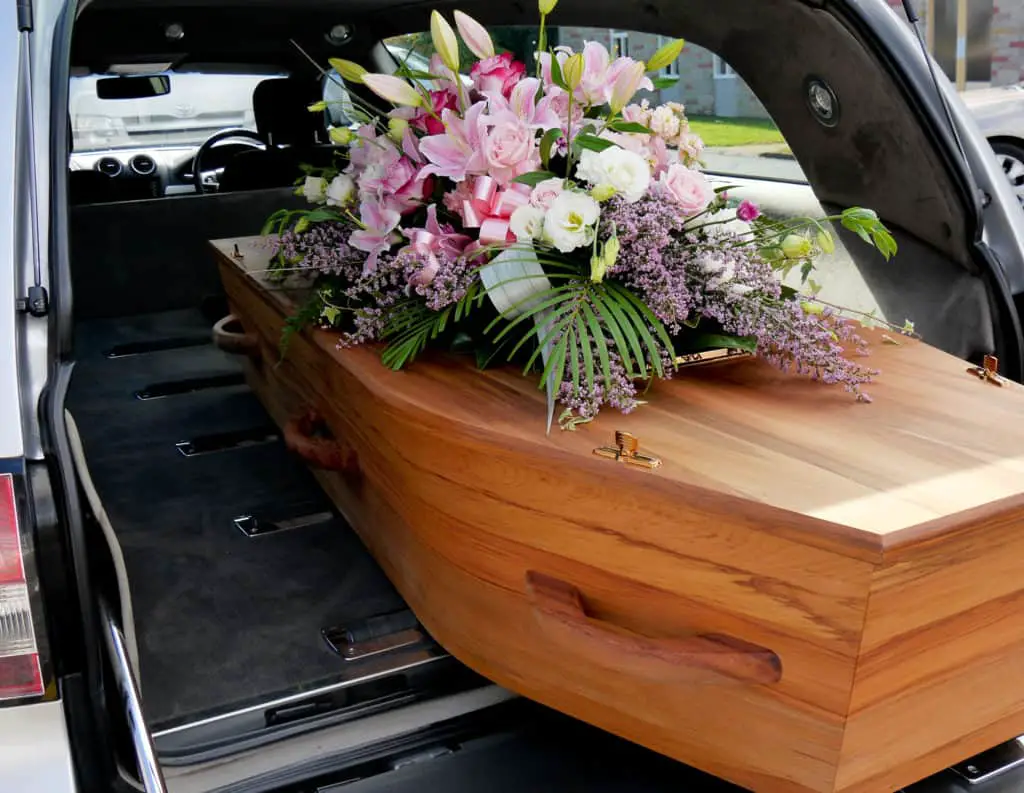 Closeup shot of a colorful casket in a hearse or church before funeral